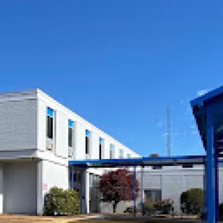 A modern building under a clear blue sky.