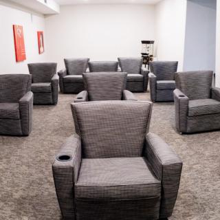 A room filled with comfortable armchairs arranged for a meeting or lounge setting.