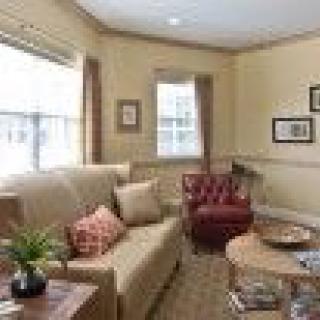 A cozy living room with comfortable seating and natural light.
