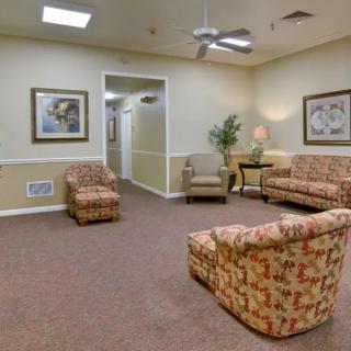 A cozy waiting room with comfortable seating and decorative elements.