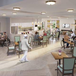 A well-lit dining area in an elderly care facility with residents and staff interacting.