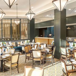 A stylish and well-lit restaurant interior with elegant furniture and dcor.