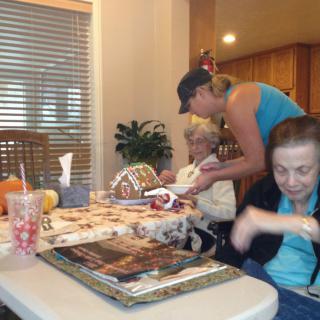 Family gathered around a table for a celebration.