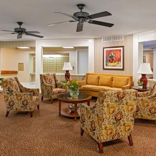 A cozy lobby with comfortable seating and warm lighting.