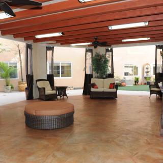 A spacious indoor seating area with comfortable furniture and natural lighting.