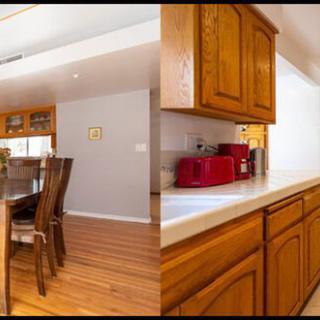 A cozy kitchen and dining area featuring wooden cabinets and a hardwood floor.
