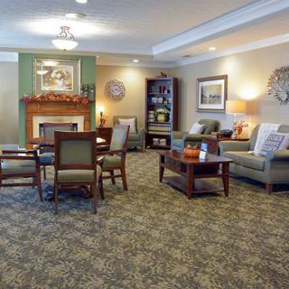 A cozy living room with a fireplace and comfortable seating arrangement.