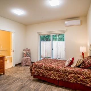 A cozy bedroom with stylish decor and modern lighting.