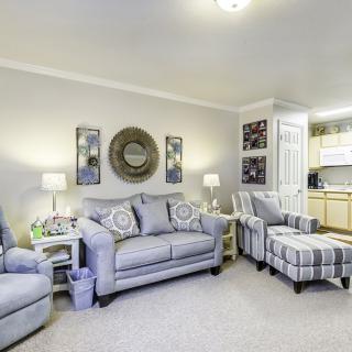 A cozy living room with elegant furniture and warm lighting.