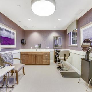 A well-lit, modern interior room with stylish seating and decor.