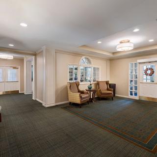 A cozy and welcoming lobby with comfortable seating and soft lighting.