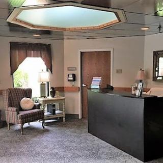 A cozy and inviting office reception area with a comfortable chair and modern decor.