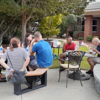 A group of friends enjoying a casual gathering outdoors.