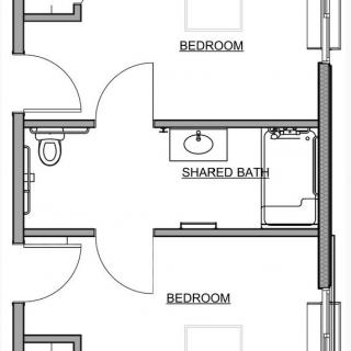 A floor plan showing two bedrooms with a shared bathroom in between.