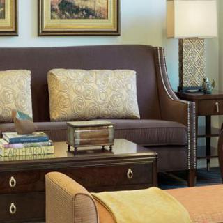 A cozy living room with elegant furniture and decor.
