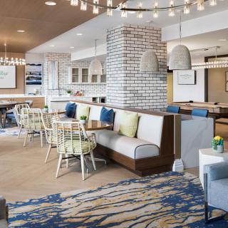 A modern cafe interior with cozy seating and stylish decor.