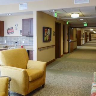 A cozy hallway with comfortable seating and warm lighting.
