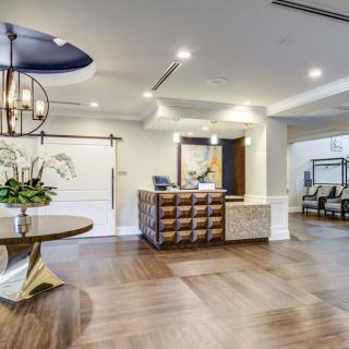 A modern reception area with elegant wood flooring and stylish decor.
