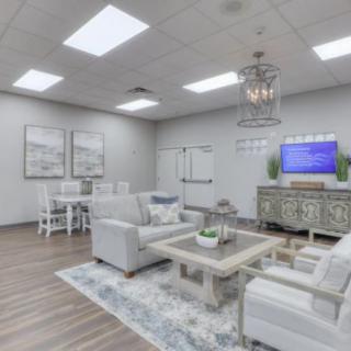 A modern living room with comfortable seating and elegant decor.