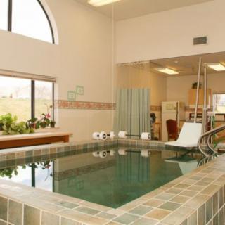 Indoor therapy pool with exercise equipment for rehabilitation