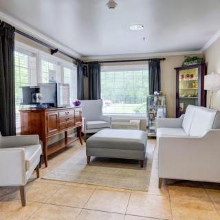A modern living room with comfortable seating and ample natural light.
