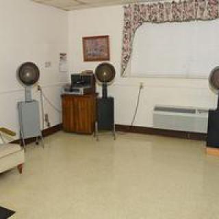 A retro hair salon with vintage dryers and classic furnishings.