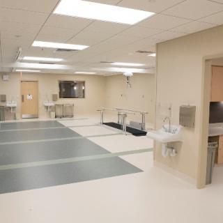 A clean and sterile medical treatment room in a hospital setting.
