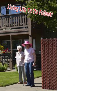 Two elderly women enjoying a sunny day in the garden.
