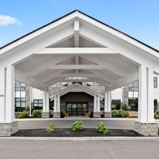 A modern building entrance with a symmetrical design and clean lines.