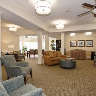 A cozy living room with comfortable seating and warm lighting.