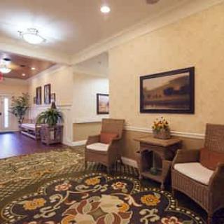A cozy hallway with chairs and decorative elements.