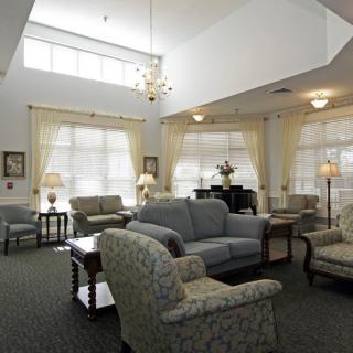 A spacious living room with comfortable seating and ample natural light.
