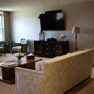 A modern living room with a comfortable sofa, coffee table, and television.