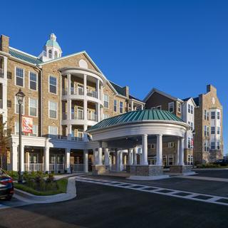 A luxurious hotel building with a grand entrance and elegant architecture.