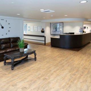 A modern reception area with a sleek desk and comfortable seating.