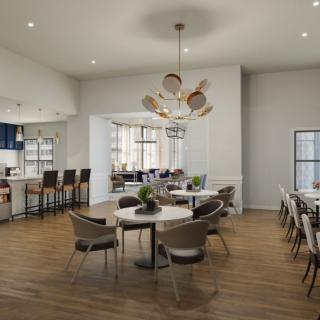 A modern dining area with elegant furniture and contemporary lighting.