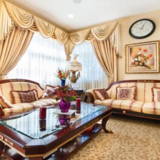 A luxurious living room with classic furniture and elegant decor.