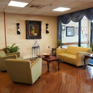 A cozy waiting area featuring comfortable seating and tasteful decor.