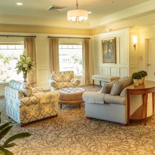A cozy living room with elegant furnishings and soft lighting.