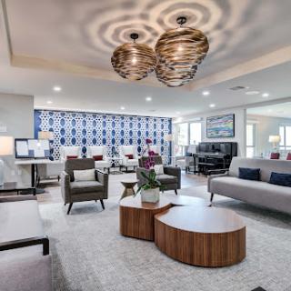 A stylish and modern living room featuring elegant furniture and contemporary lighting.