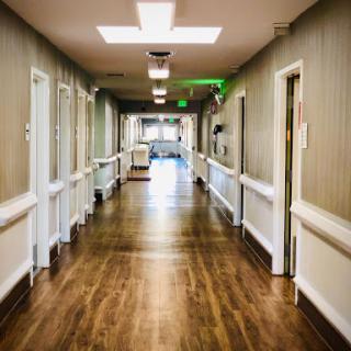 A clean and well-lit hallway in a healthcare facility.