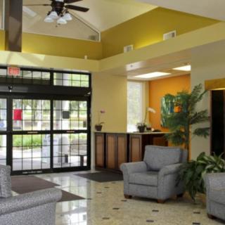 A welcoming lobby area with comfortable seating and a reception desk.