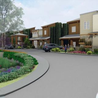 A modern residential neighborhood with landscaped surroundings and contemporary houses.