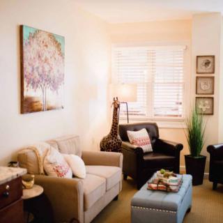 A cozy living room with comfortable seating and stylish decor.