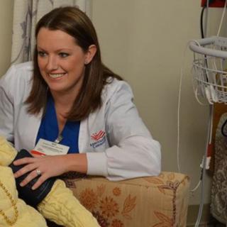 A nurse providing care to a patient in a hospital setting.