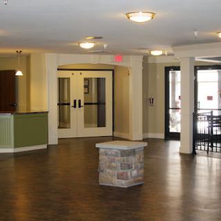 A spacious lobby area featuring modern design elements and ample lighting.