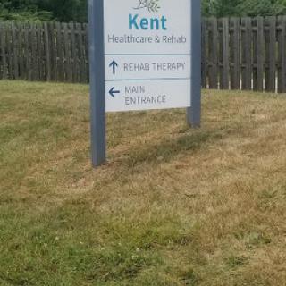 A sign indicating a location in Kent with directional arrows.