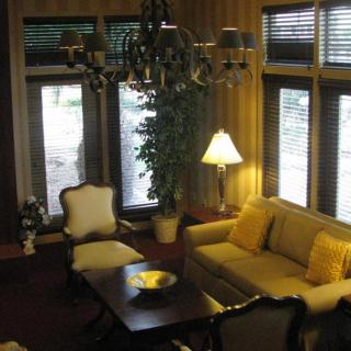 A cozy living room with elegant furniture and soft lighting.