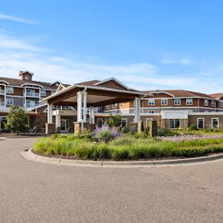 A welcoming residential lodge set in a landscaped environment.