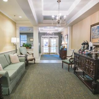 A cozy lobby area with seating and elegant decor.